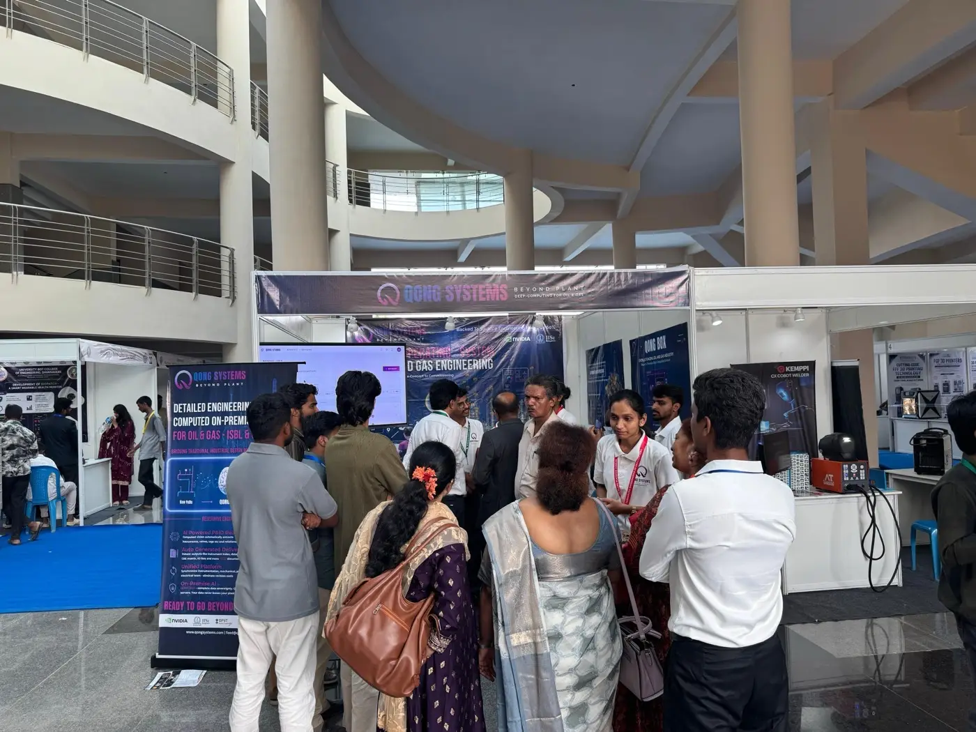 Visitors gathered at the QONG Systems stall during the exhibition